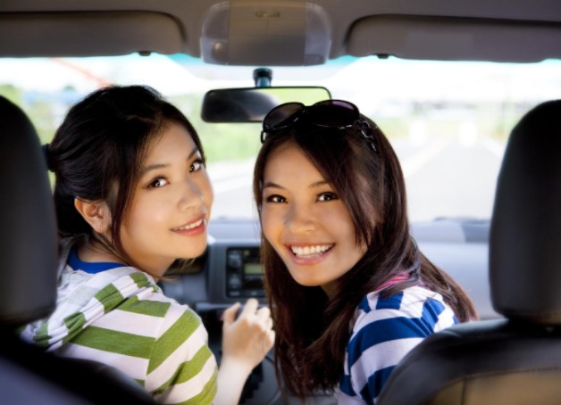 happy girls in the car and enjoy driving